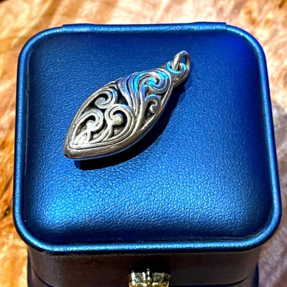 Sterling Silver Scrollwork pendant.
